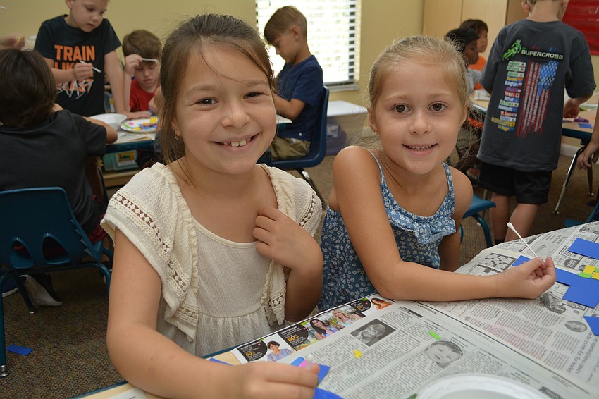 Gene Witt Elementary's Emersyn Fielding and friend Sophia Hopkins enjoy doing a craft together.