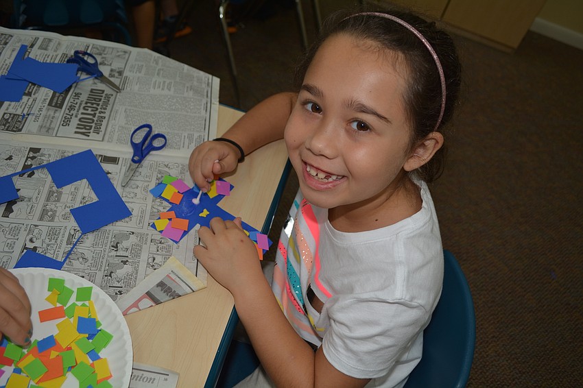 Seven-year-old Bella Cesare is all smiles during craft time.