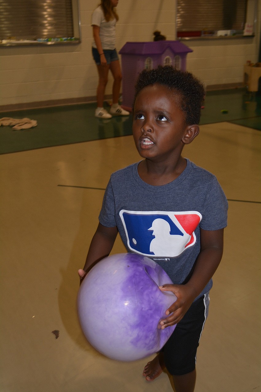 East County's Silas Fulmer works hard to score a basket.