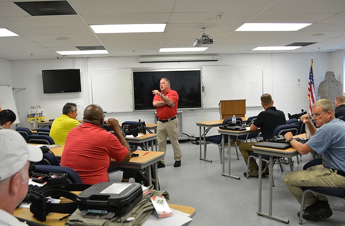 Manatee County Sheriff's Office Dep. Lou  Gregory conducts in-classroom training of guardians at the sheriff's office training center.