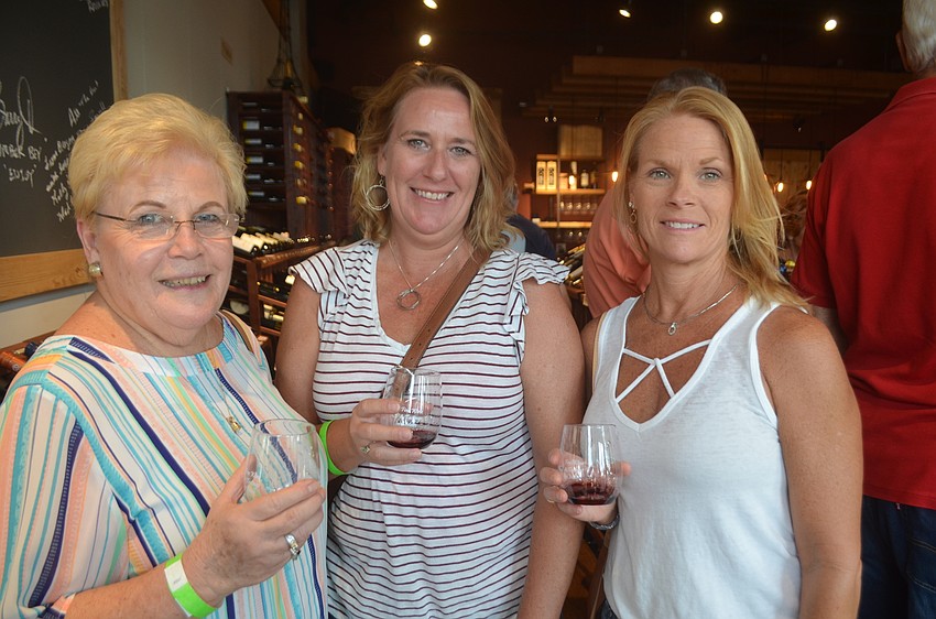 Bradenton's Judy Young and Tammy Lyday, and Country Club's Theresa Young, say they are enjoying a girls night out at Wine Walk Wednesday.