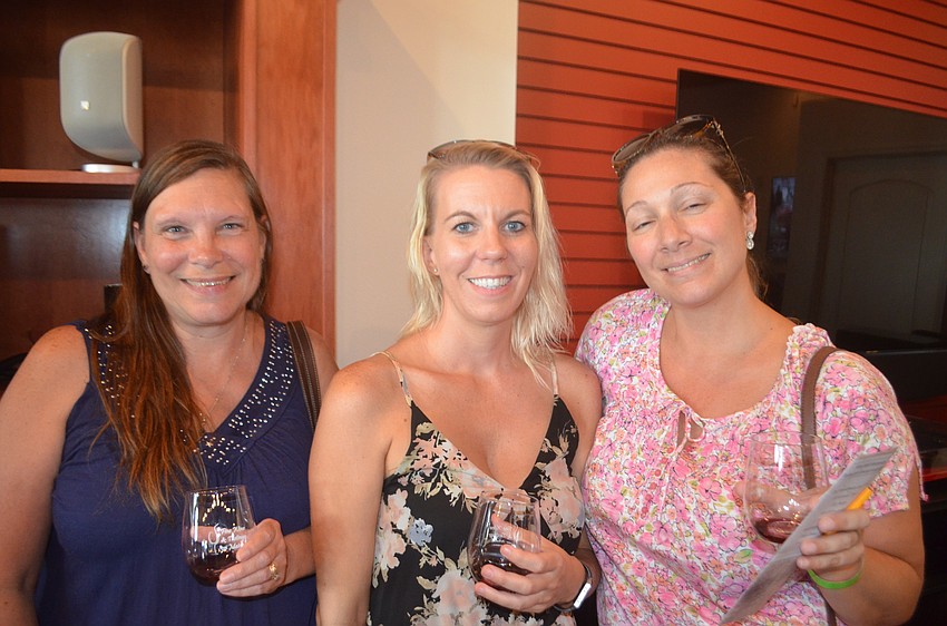Bradenton's Cheryl Adams, Cynthia Flores and Constance Murphy enjoy their stops along the Wine Walk Wednesday trail.
