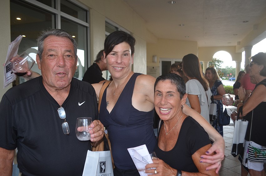 Venice's Burt Liberi and Karen Liberi and Mote Ranch's Andrea Gilder enjoy a good time during Wine Walk Wednesday.