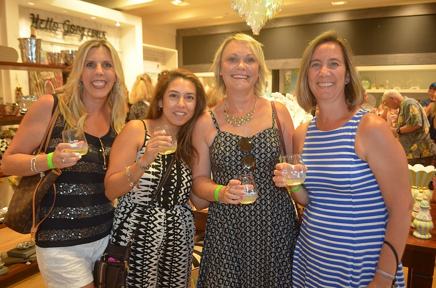 Lakewood Ranch's Lisa Holler, Annie Talbert, Michelle Hardin and Traci Kundrat enjoy one of the stops on Wine Walk Wednesday.