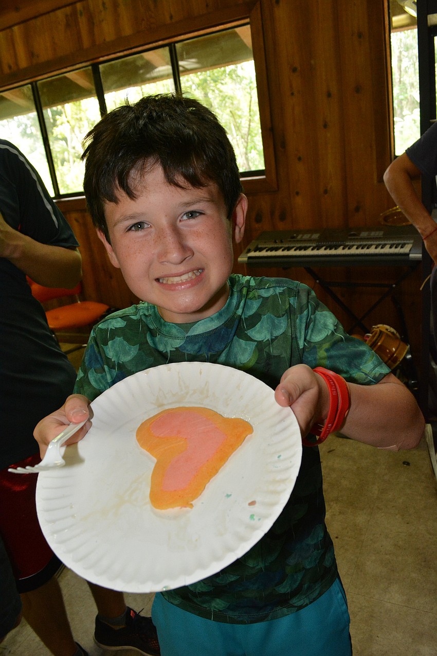 Jackson Weiss, 10, loves his pancakes. Camp included cooking classes.