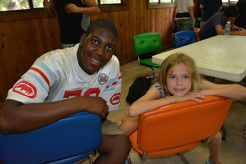 Braden River High's Trent Edney hangs out with fellow camper Emily Rous, 12.