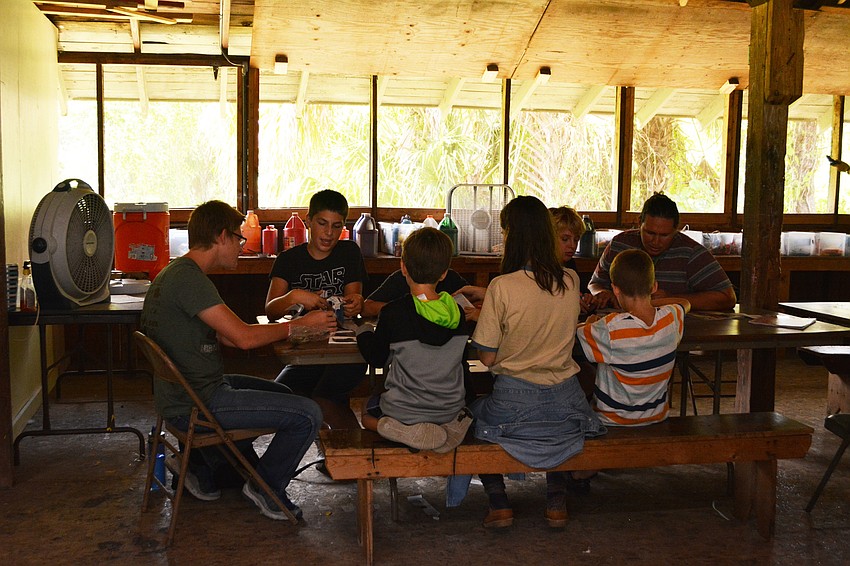 Campers work on arts and crafts.