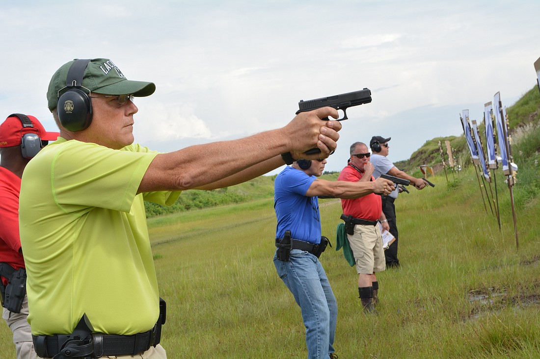 Retired policeman and guardian Mike Parker said the position is a perfect fit for retirement. He practices with his new firearm during training at the Manatee Gun & Archery Club.