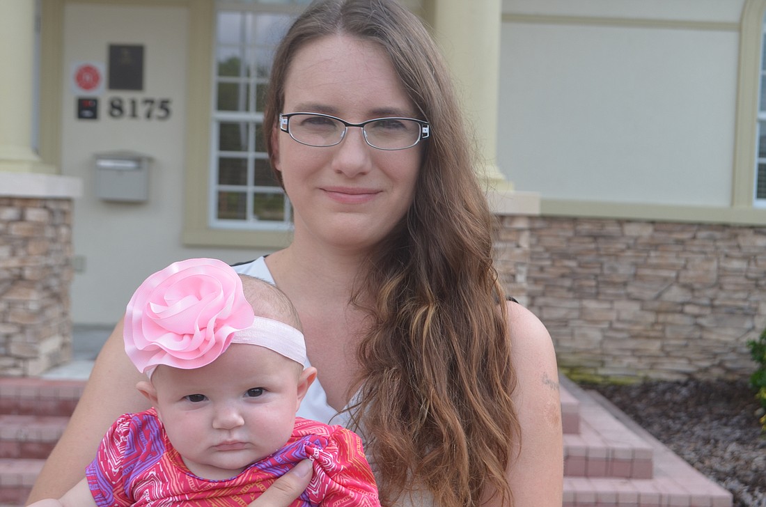 Jennifer Murray, shown with her daughter, 4-month-old Kelci, is starting a Pop Up Market in Lakewood Ranch.