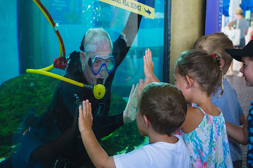 Children say hello to diver Ian Ramsbottom.