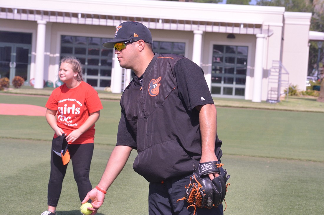 Christian Turnipseed pitches at the Orioles Girls Inc. clinic on July 27.