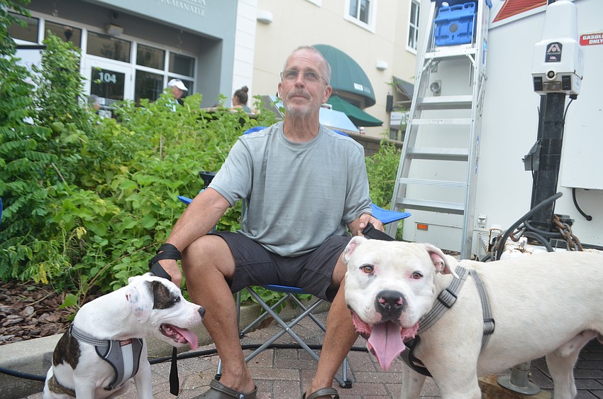 Bradenton's Blair Cook brings his dogs, Abel and Cain, to every Music on Main to help socialize them.