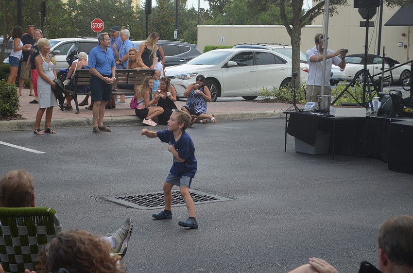 Six-year-old Ethan Intelisano, from Panther Ridge, performs for his audience.