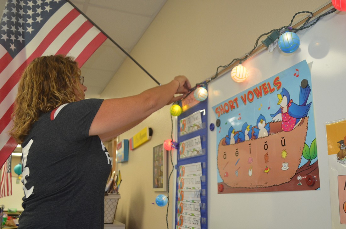 Kristen Chapman sets up her classroom for the first day of school.