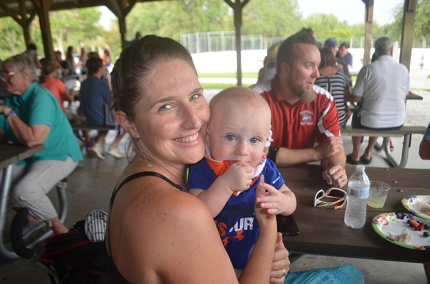 Ellenton's Katy Wiles and her 7-month-old baby, Grant Wiles, snuggle at the picnic.