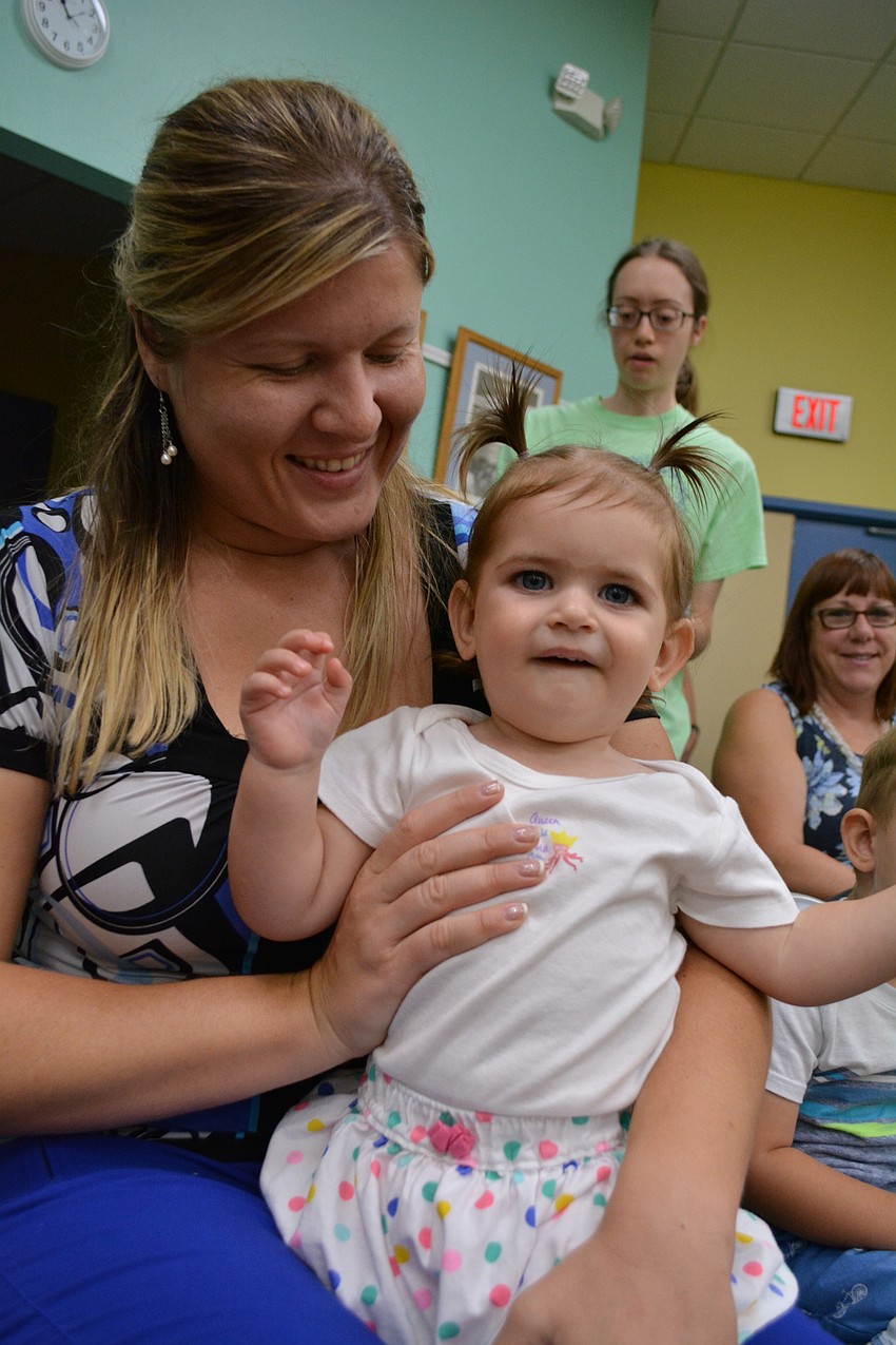 Palm-Aire resident Yelana Pobezhimova holds her daughter Leah Akbulut during the show.