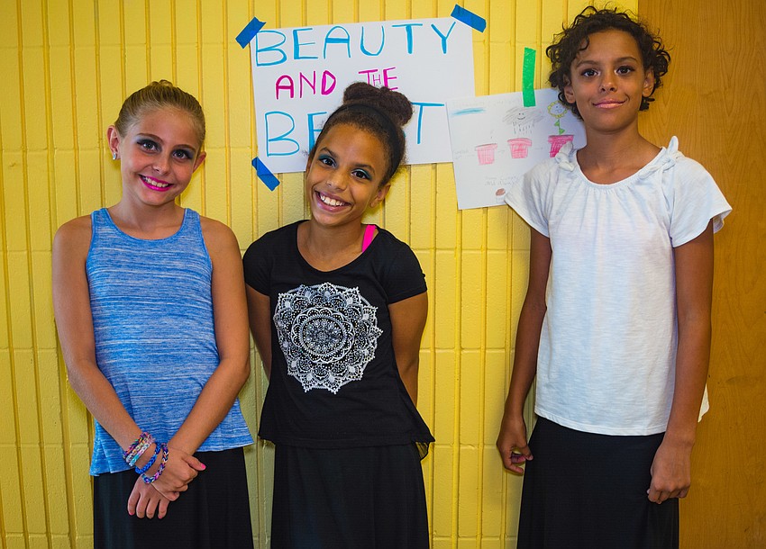 Girls Inc. members Evie, Dayanny and Tatiana get ready backstage.