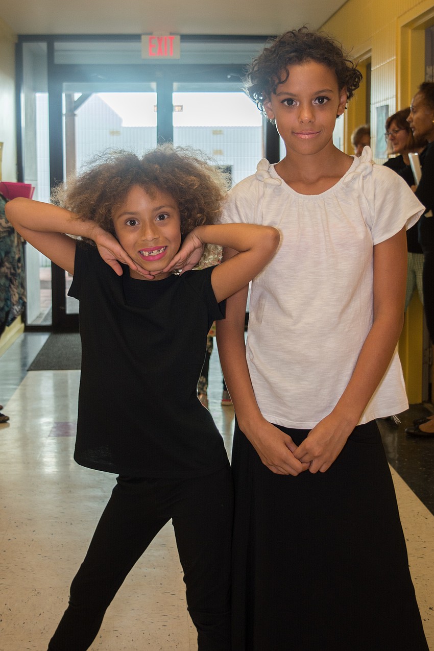 Girls Inc. members Karile and Tatiana get ready backstage.