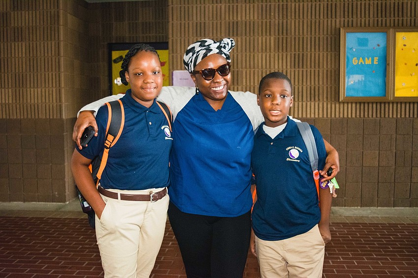 Emma E. Booker Elementary students Taylor and Tyler Humphrey with their mother, Viola.