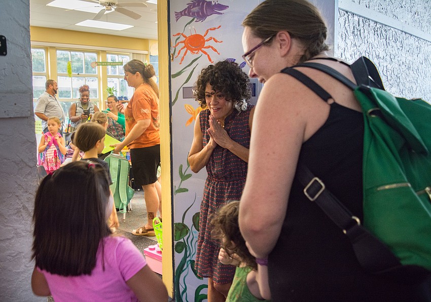 Bay Haven School of Basics Plus kindergartner teacher Aurelia Webber greets her students.