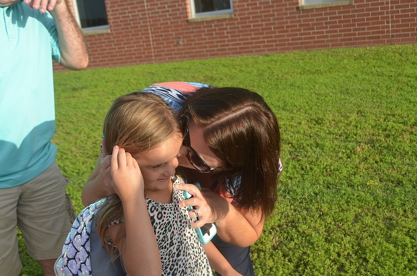 Kim Bittar gets a little emotional as she watches her kindergartner, Lauren (5), head off into Gullett.