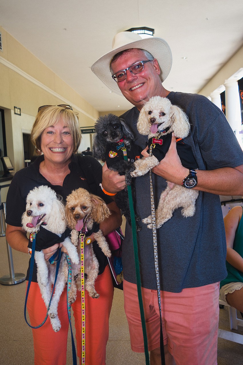 Eric and Sheila Nichols with their dogs Margarita, Salt, Martini and Shaker.