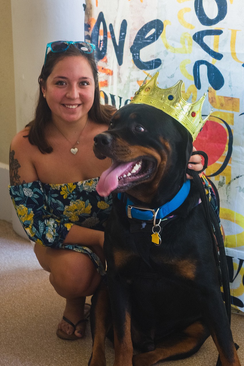 Haley Waitkun poses with her dog, Hades, in the photo booth.
