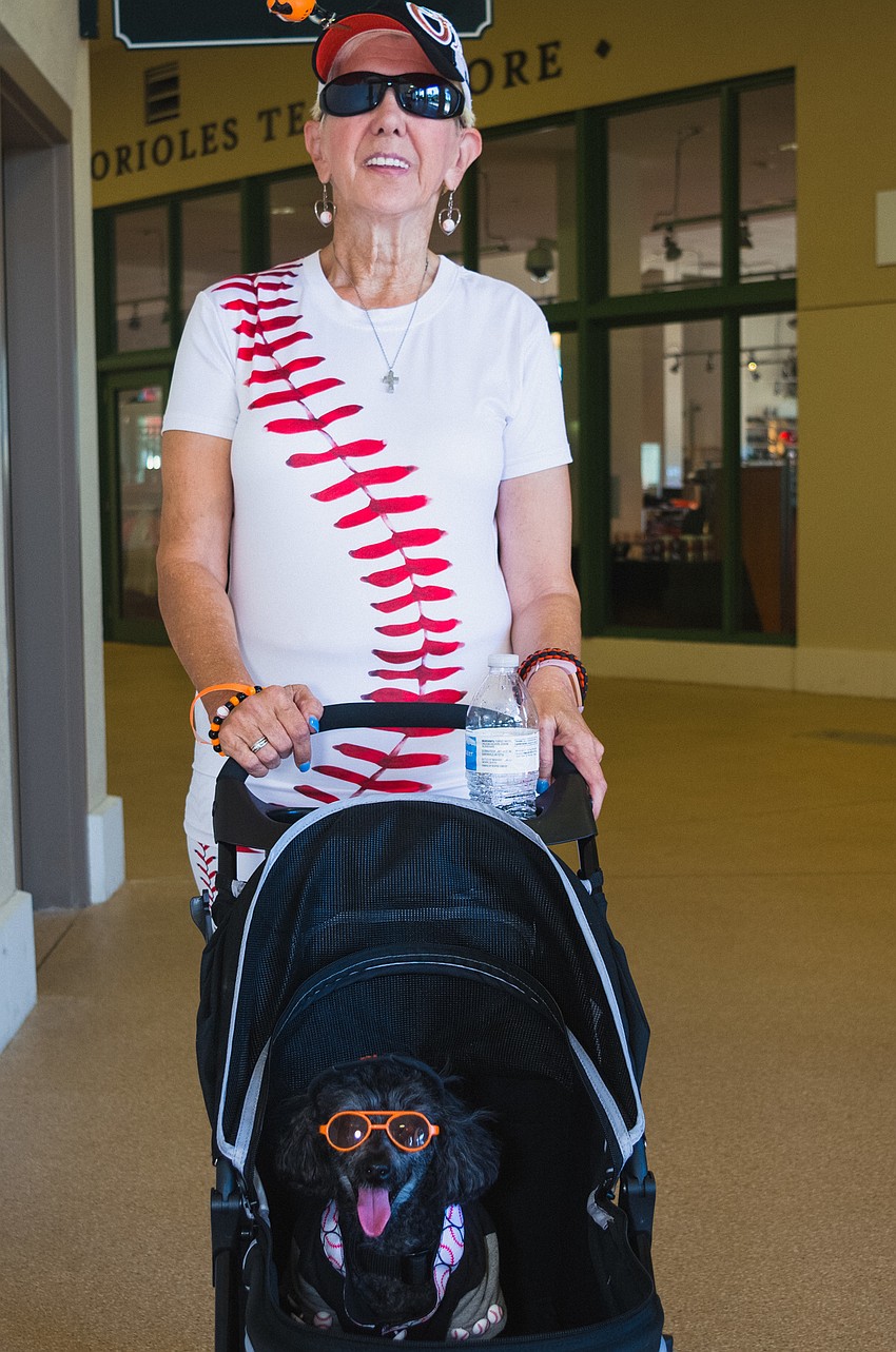 Stephanie Loring pushes her dog, Andrew James, along.