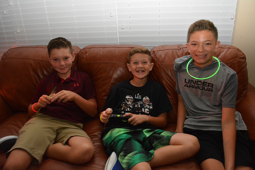 Killian Kaliher, Cole Zuck and Ian Gilkison find a place to relax.