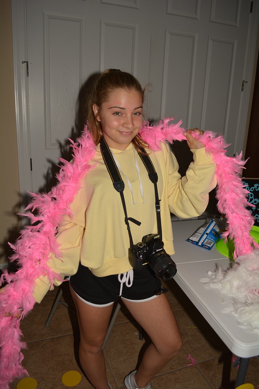Southeast High School freshman Jade Fisher volunteers to man the photo booth.