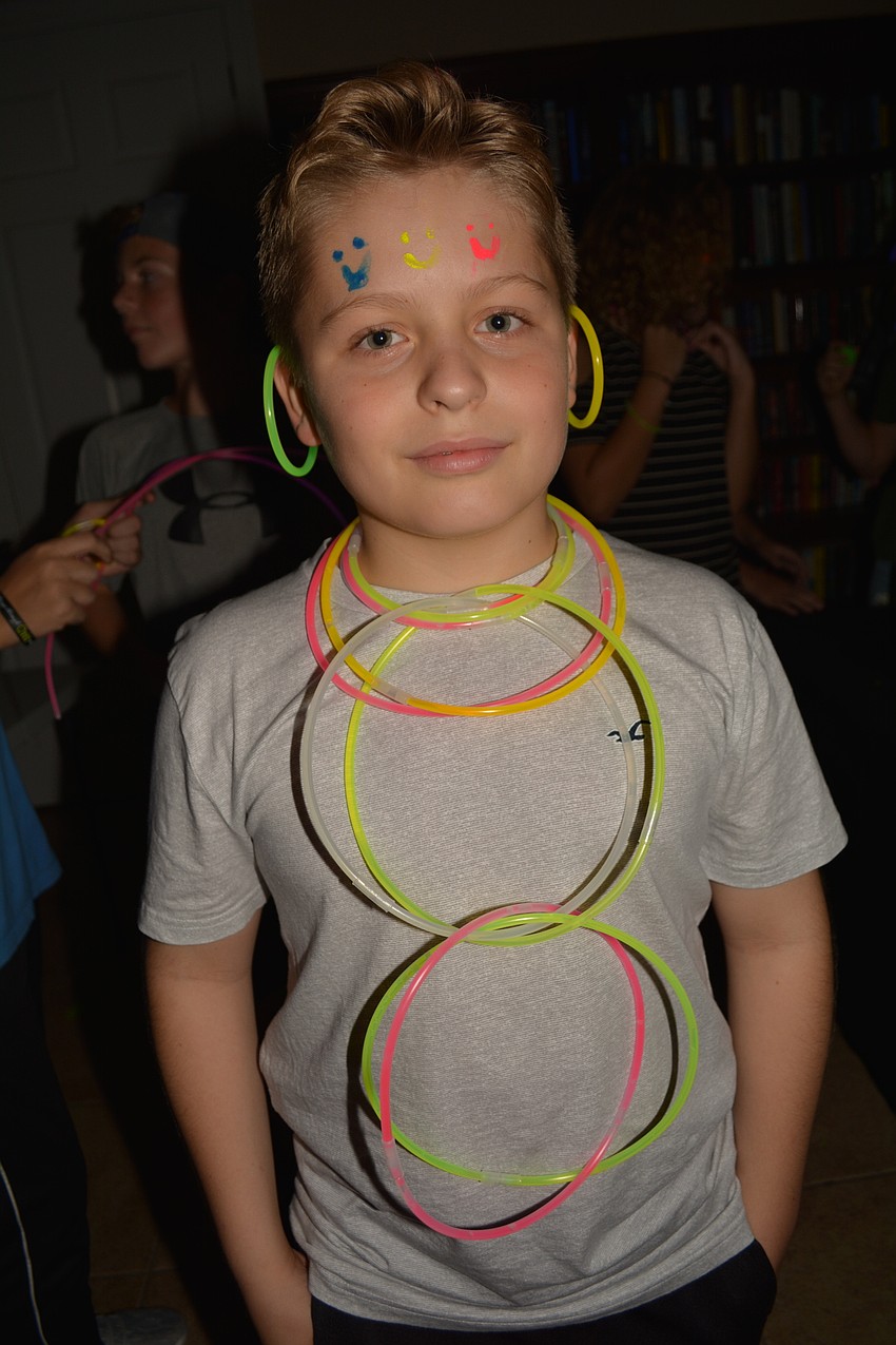 Twelve-year-old Evan Fisher likes his glow sticks.