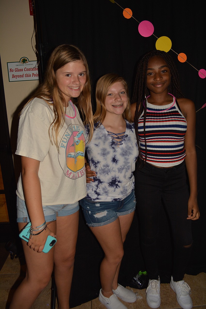 Katie Onstine, Kaylee Shear and Naika Dumorne enjoy the party.