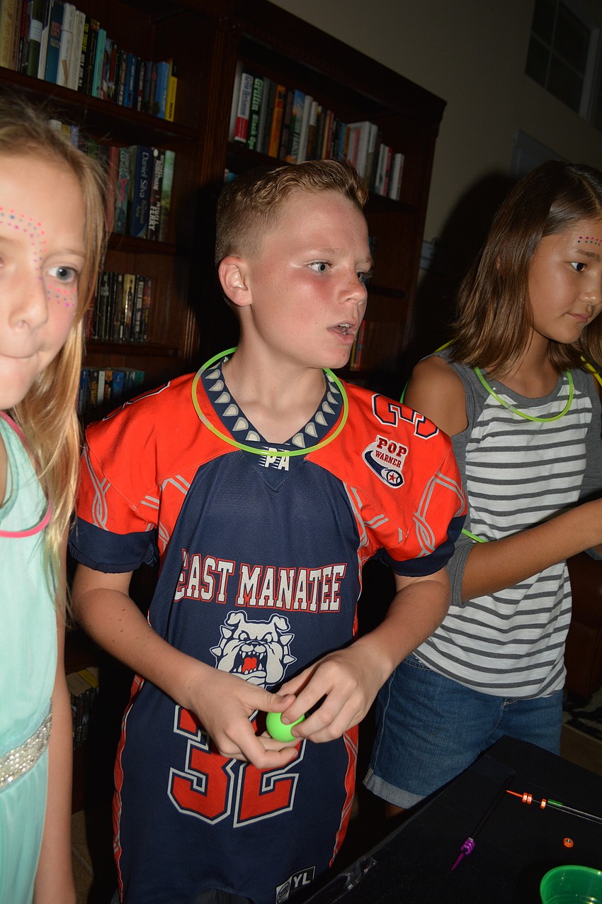 Eleven-year-old Benji Best proves a strong competitor at ping pong games.