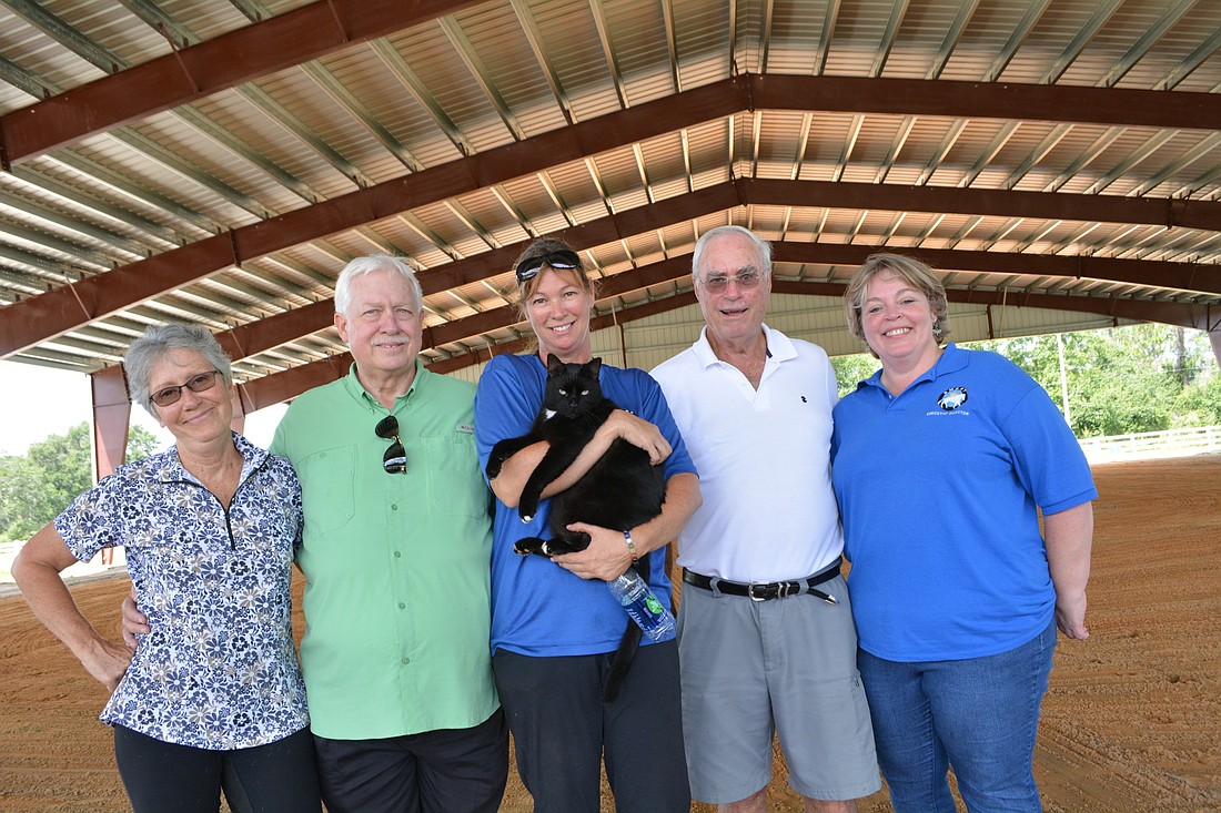 SMART retired Executive Director Gail Clifton, advisory board member Nick Drizos, Barn Manager Samantha Toomey, Board member John Moore and Executive Director Brandi Ezell are excited the arena now can be used year round.