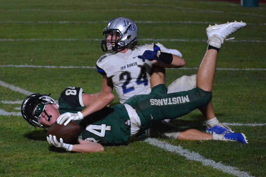 Senior Mustangs wideout Josh Lundy (84) makes a falling catch for LRHS. The catch put the team at the two-yard line with three seconds remaining.