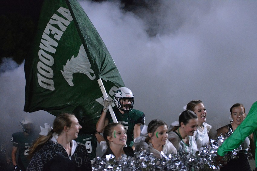The Mustangs burst out of their new smoke tunnel.