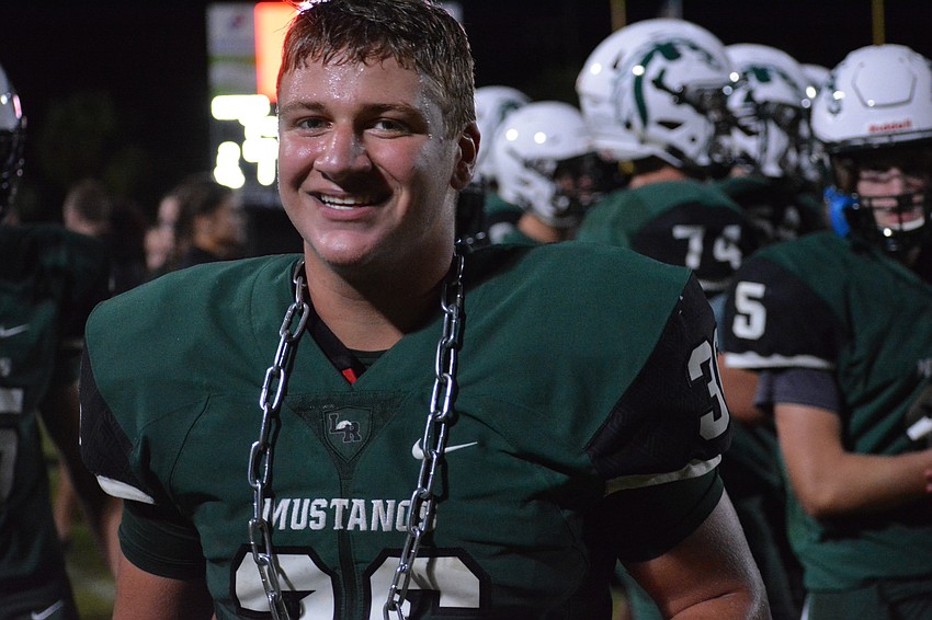 Junior linebacker Christopher Kourakos smiles with his  