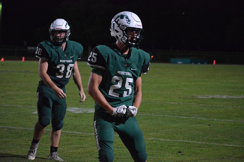 Junior corner Jake Zapatha (25) flexes after making a big hit.