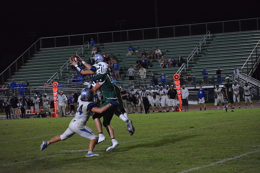 Senior wideout Josh Lundy gets double-teamed downfield in the waning seconds of the Mustangs' 21-14 loss to Ida Baker.