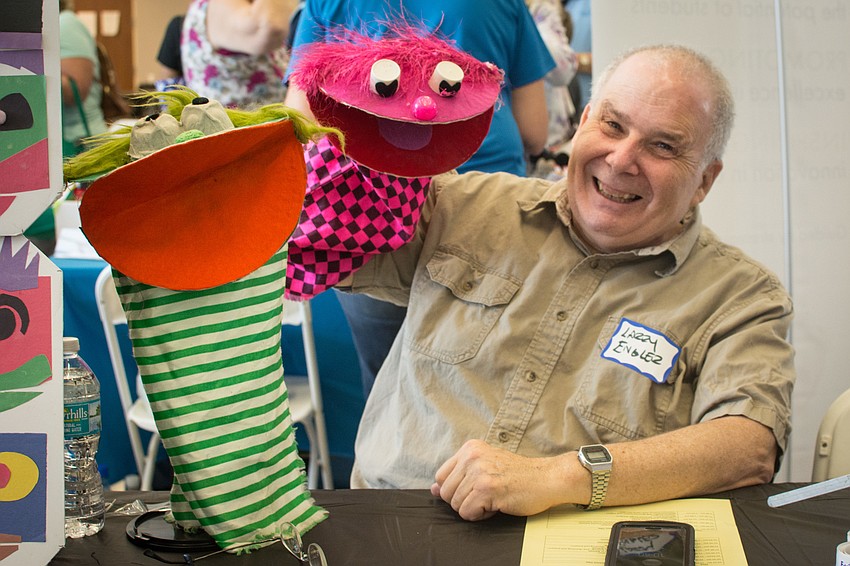 Larry Engler showcases his puppets.