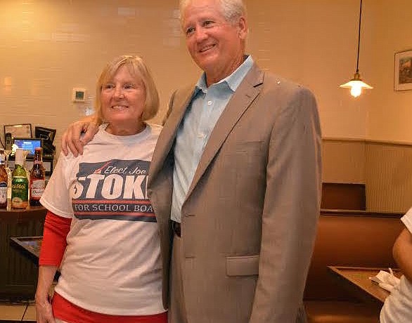 Linda Stokes celebrates her husband Joe's showing in the school board election. He moves to a runoff against incumbent Scott Hopes in November.