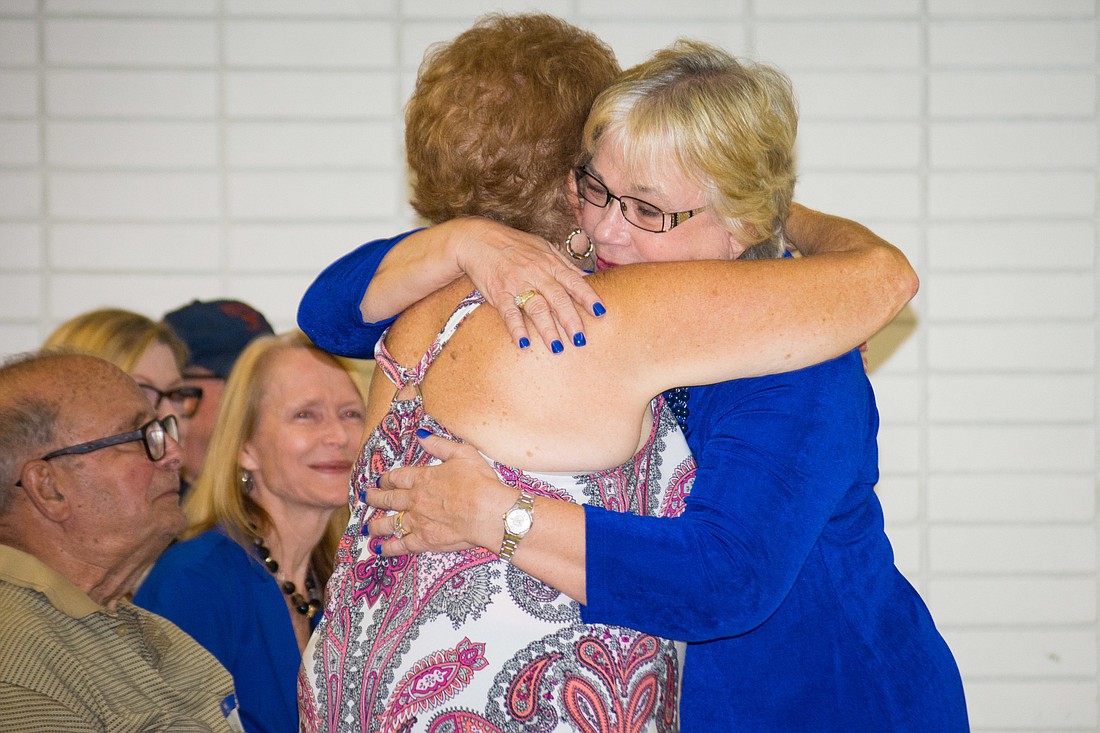 Shirley Brown hugs a supporter.