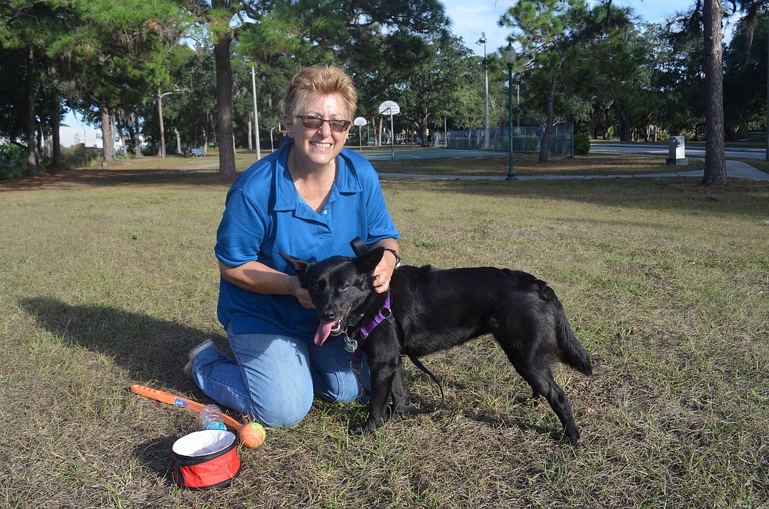 Dale Orlando and her dog, Shadow, are excited about the ability to let dogs run off-leash in a neighborhood park.