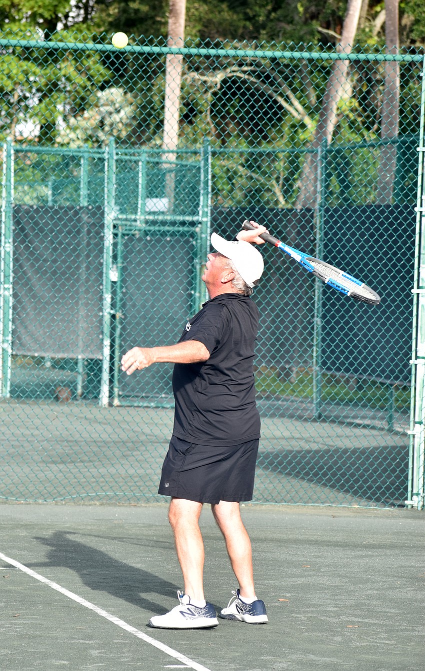 Bill Upton serves the ball.