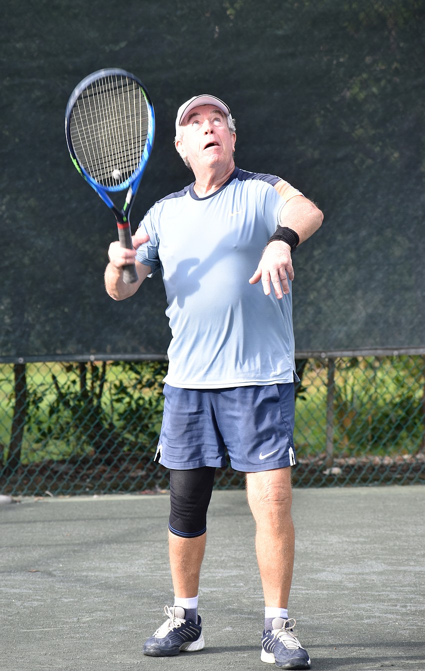 John Short gets ready to serve the ball.