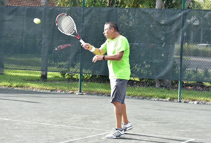 John Kurgan serves the ball.