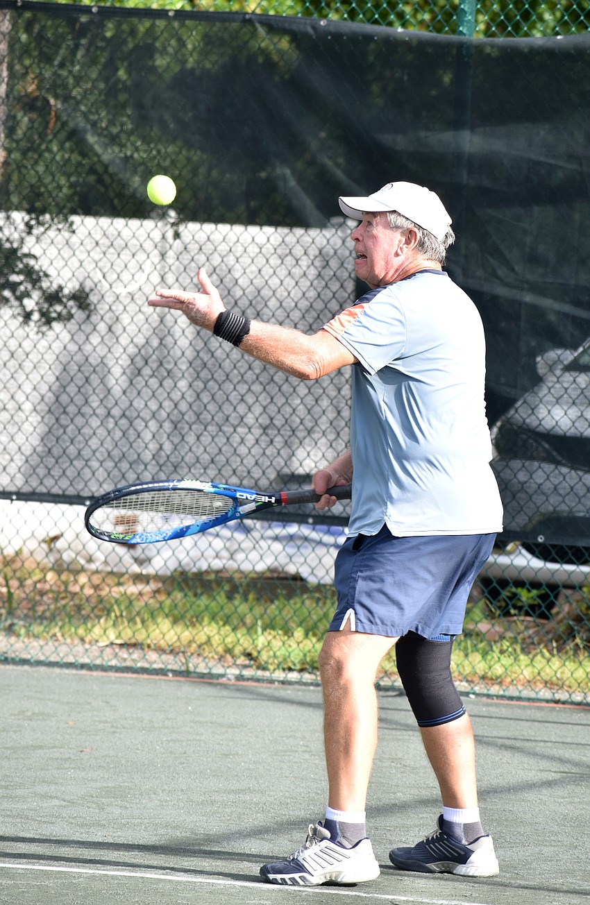 John Short serves the ball. Since 2011, Short has organized matches for The Short Academy.
