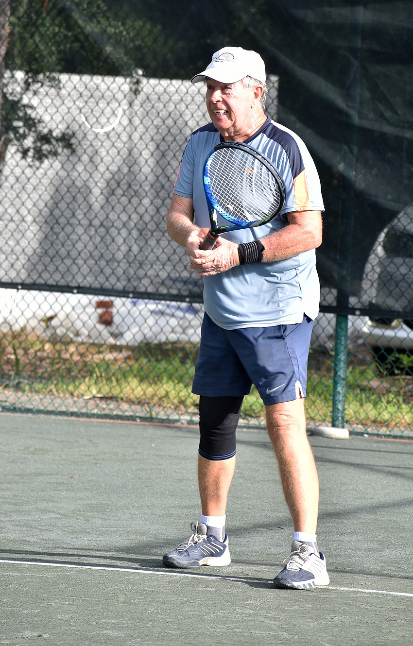 John Short serves the ball. Since 2011, Short has organized matches for The Short Academy.