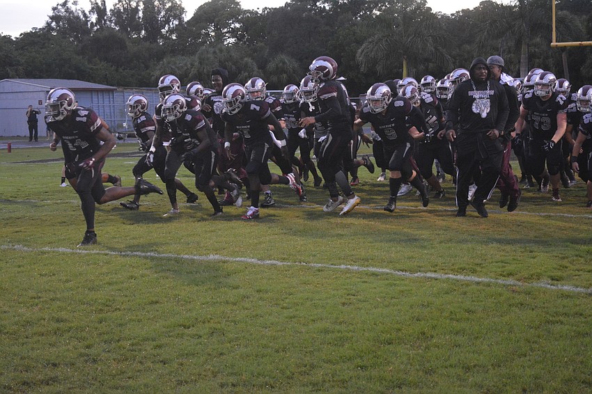 The Rams take the field.