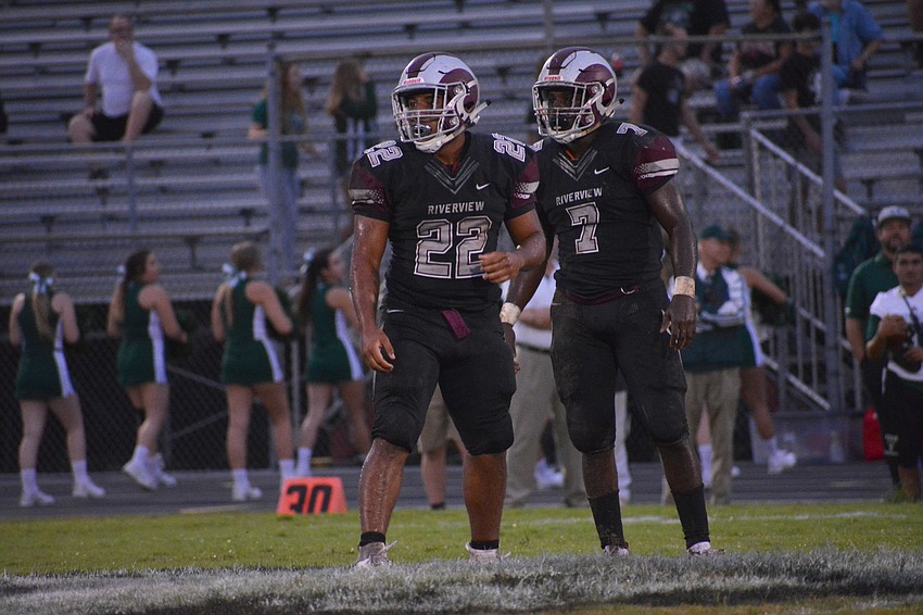 Ali Boyce and Michael Hayes look to the sideline for the play call.
